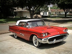 photo of a red 1959 t-bird classic car