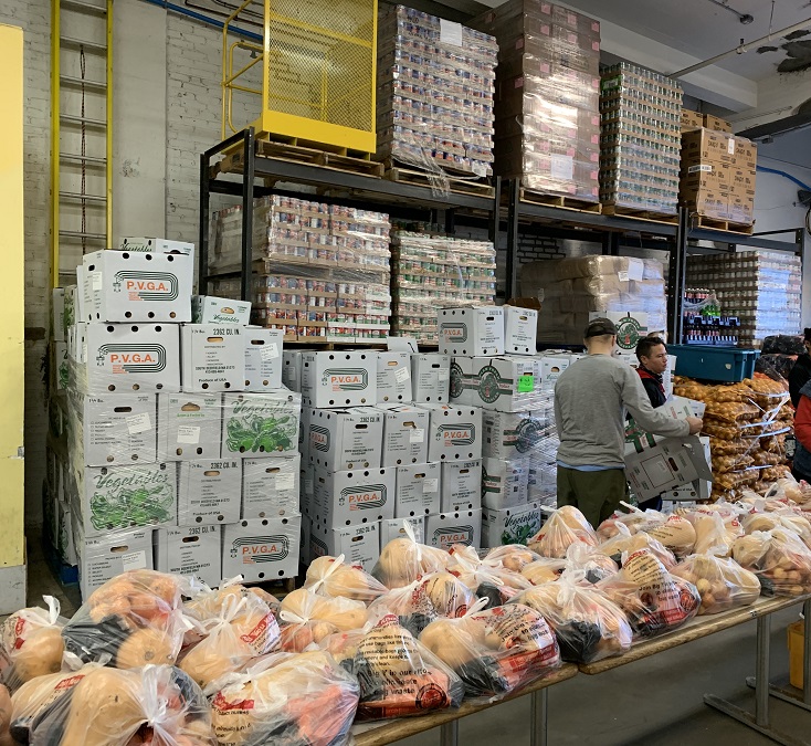 Picture of mounds of food to be distributed at the Boston Red Cross Food Pantry