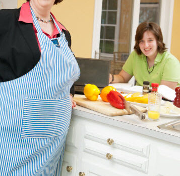 Photo of Marcia and Lindsay Mantell from a photo shoot in the kitchen. Always trying to find work-life balance.