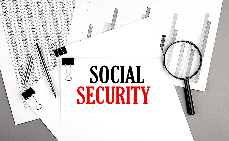 Stack of papers and charts labeled Social Security