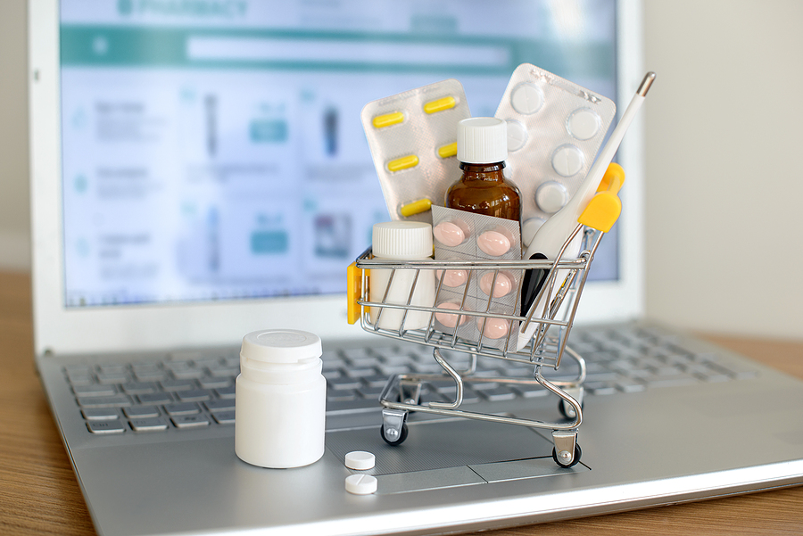 Grocery cart with drugs on a laptop