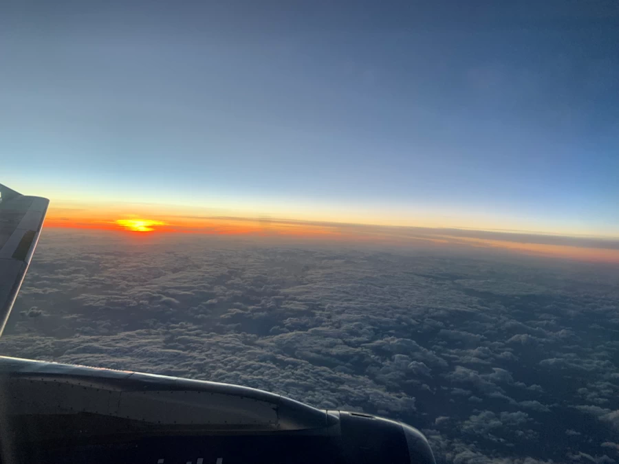 Sunset while flying above the clouds