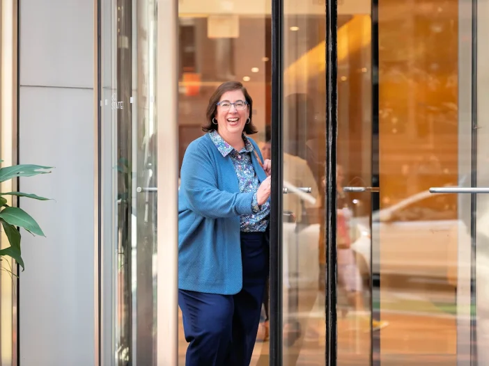 Retirement expert Marcia Mantell existing the office